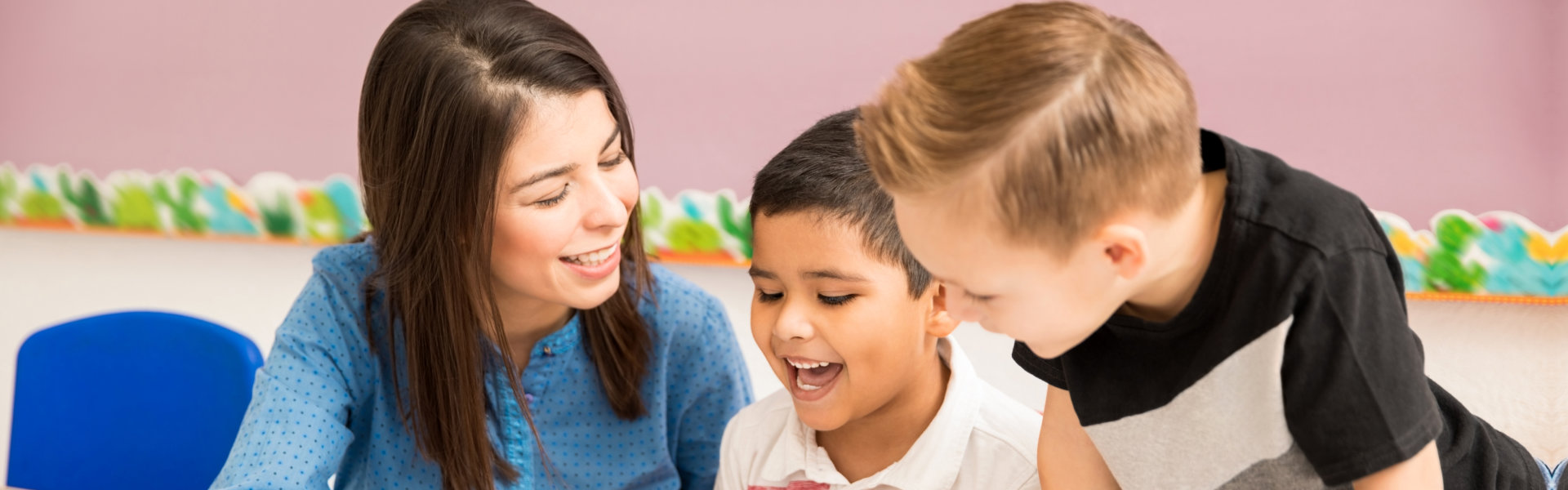 teacher and little boys smiling together