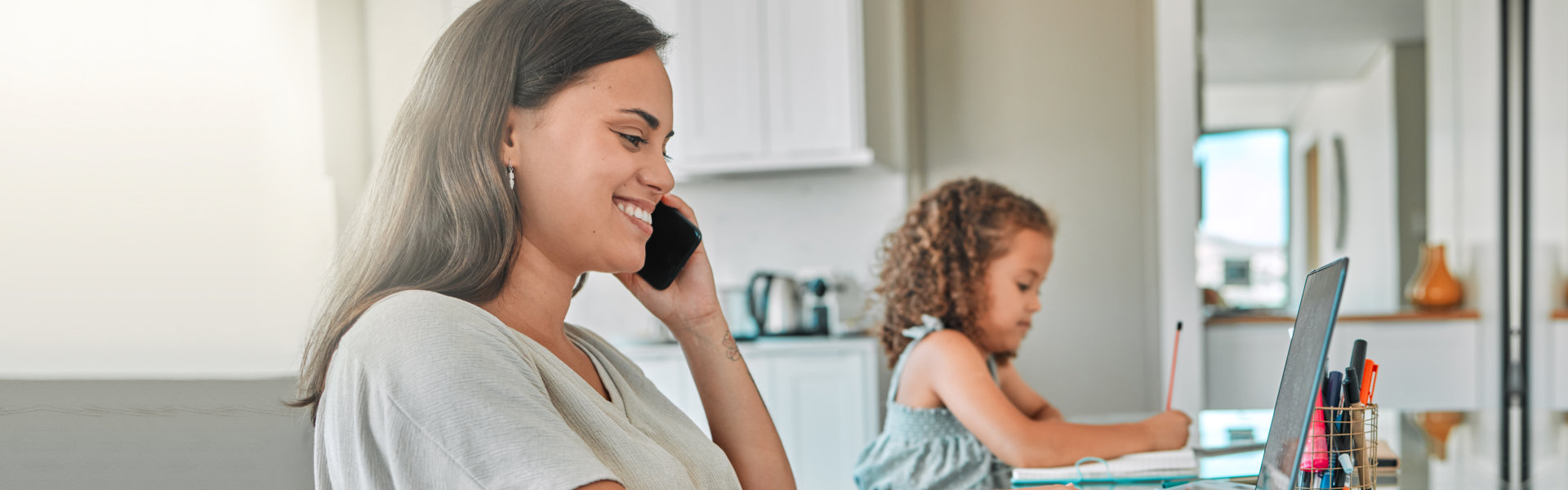 woman smiling while having a phone call